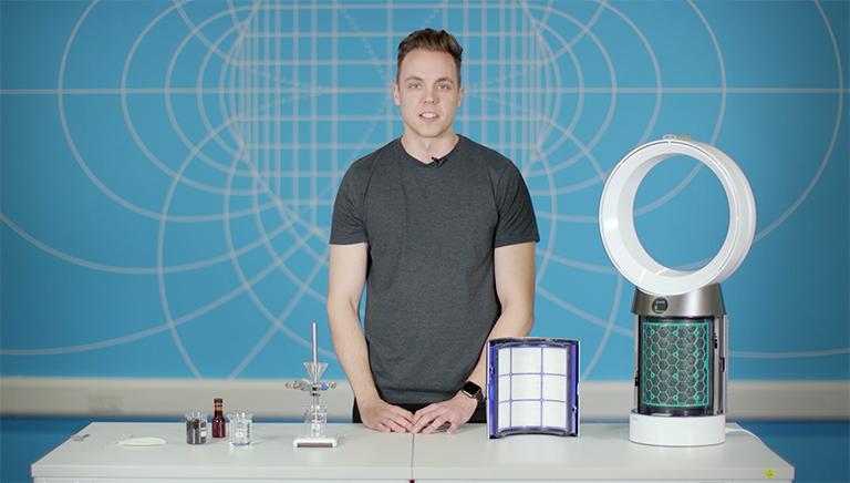Dyson engineer standing at a lab bench with purifier filters